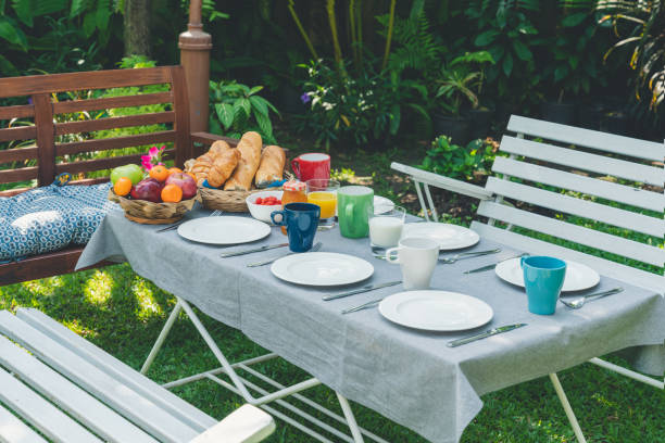 istock Breakfast table with food in the garden 1182093486
