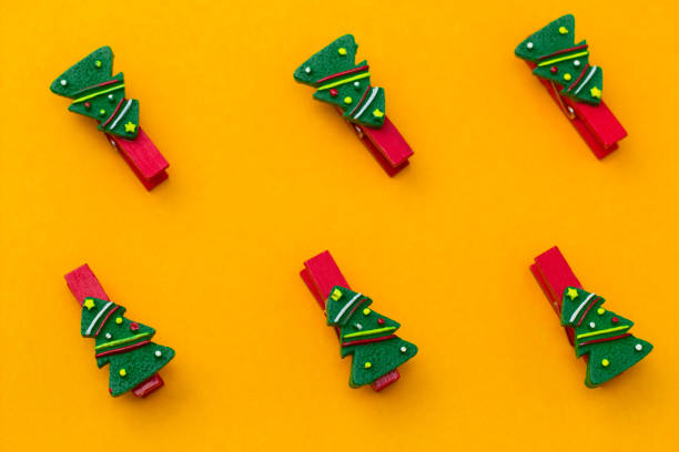 istock flat lay festive red clothespins decorated with christmas tree 1182096148