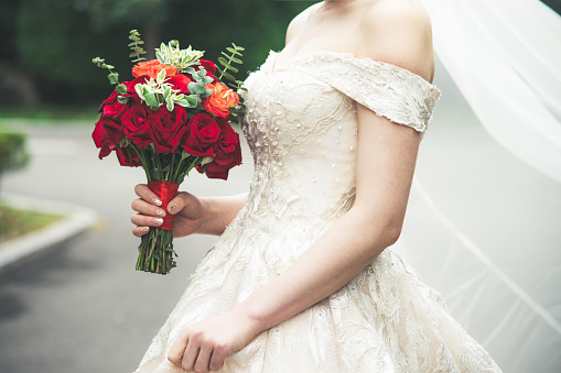 Bride posing with a bouquet