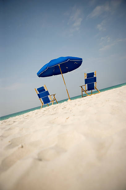 istock Lounge Chairs and Umbrella On The Beach 118210116