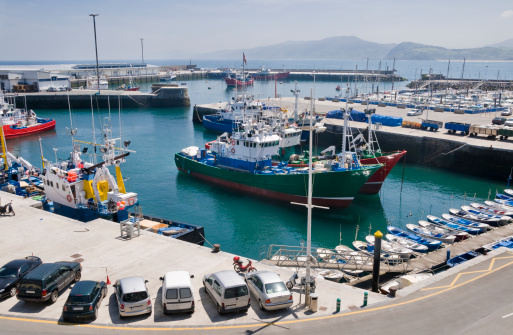 Larne, United Kingdom - 6 July, 2022: view of the industrial port and ferry harbor of Larne on the coast of Norther Ireland