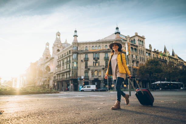 Tourist visiting Barcelona Woman with suitcase walking at the street in Barcelona la rambla stock pictures, royalty-free photos & images