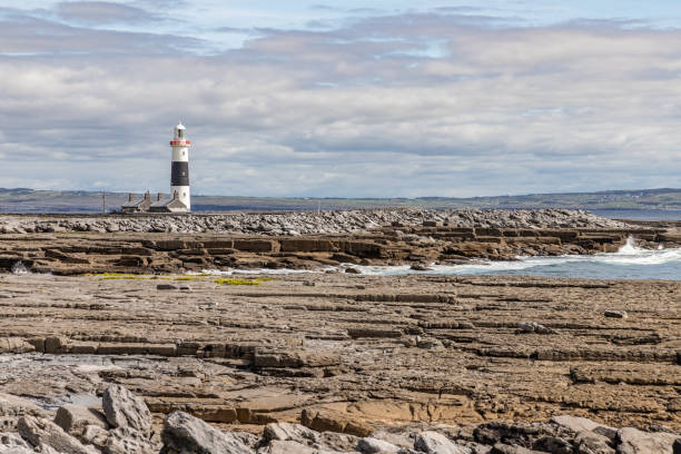istock Lighthouse  and rocky beach in Inisheer island 1182111603