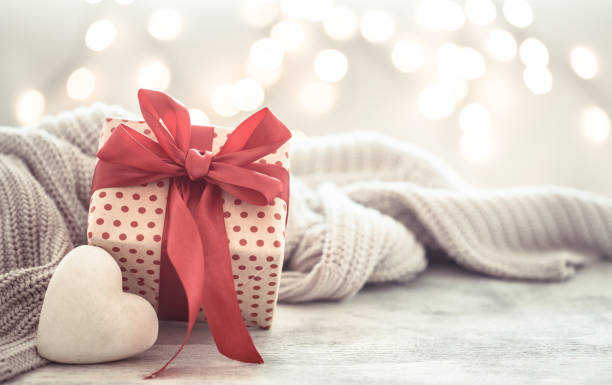 istock Background holiday, gift in a beautiful box with a heart . 1182115727