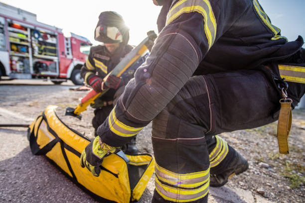 istock Firefighters in a rescue action in a car accident 1182115869
