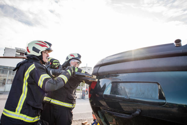 istock Firefighters in a rescue action in a car accident 1182117200