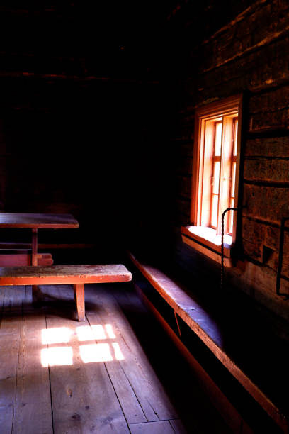 istock Light coming through window in wooden house 1182117475