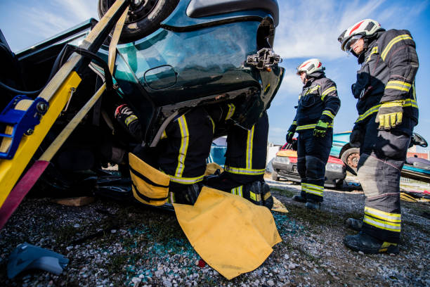 istock Firefighters in a rescue action in a car accident 1182117533