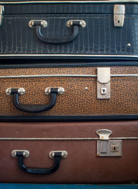 istock Three old suitcases on top of each other. 1182120248