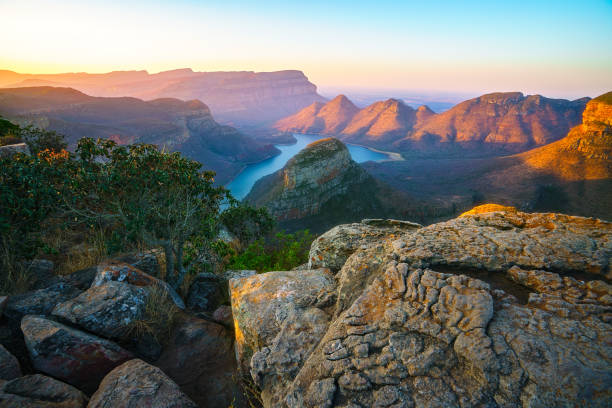 three rondavels and blyde river canyon at sunset, south africa 53 view of three rondavels and the blyde river canyon at sunset in south africa blyde river canyon stock pictures, royalty-free photos & images