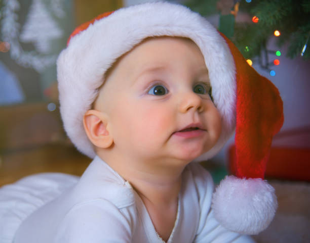 istock Baby Boy Wearing Santa Hat 1182121104