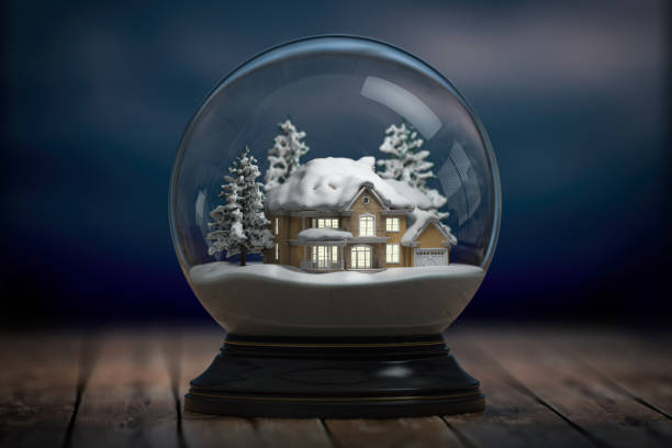 glass-snow-globe-and-a-house-with-lights-in-windows-in-the-night.jpg