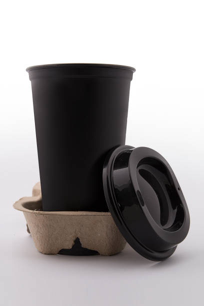 istock luxury plastic black coffee cup with black lid isolated on white background - mock up 1182122183