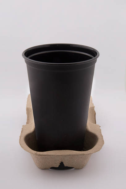 istock luxury plastic black coffee cup with black lid isolated on white background - mock up 1182122208