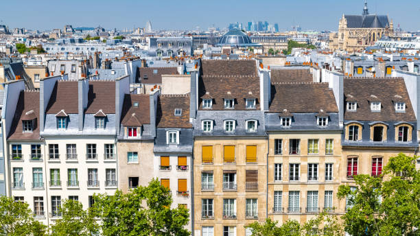 Paris, typical roofs in the Marais Paris, typical roofs in the Marais, aerial view with the Halles, the Saint-Eustache church and the Defense in background pompidou center stock pictures, royalty-free photos & images