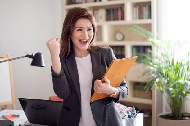 istock young business woman in an office 1182122513