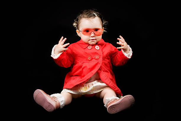 istock Happy toddler with red jacket and sunglasses 118212589