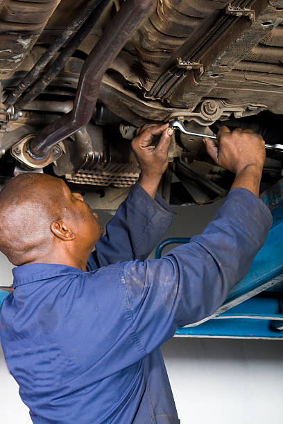 istock An African American. Mechanic in a blue uniform 118212625