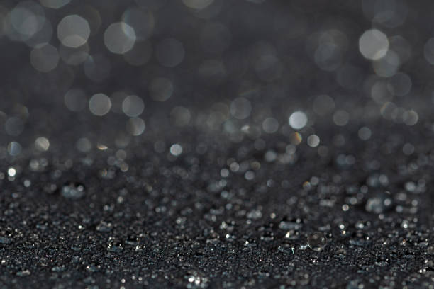 istock dark gray waterproof hydrophobic flat cloth closeup with rain drops selective focus background 1182127005