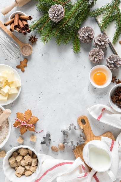 istock Christmas or Xmas baking culinary background. Ingredients for cooking pastry on kitchen table. New Year, X-mas or Noel holiday festive decorations with fir tree, copy space 1182128453