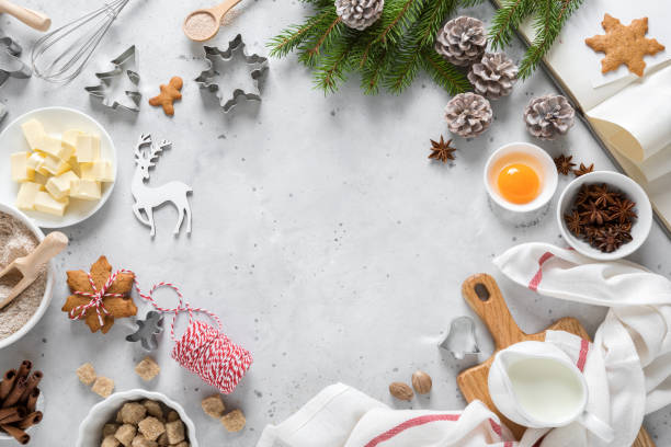 istock Christmas or Xmas baking culinary background. Ingredients for cooking pastry on kitchen table. New Year, X-mas or Noel holiday festive decorations with fir tree, copy space 1182128495