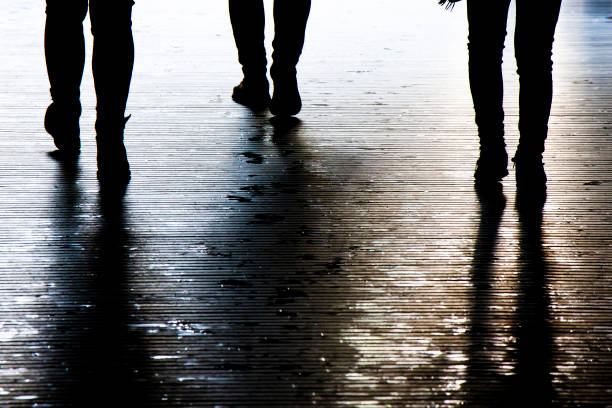 Blurry shadow silhouette of a people walking in the night, detail stock photo