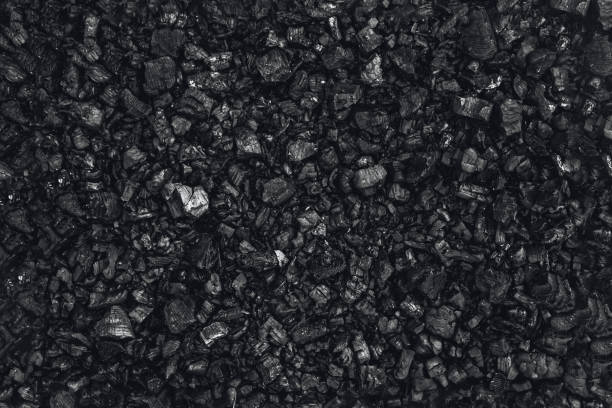 istock Dark coal texture, coal mining, fossil fuels, environmental pollution. 1182138121
