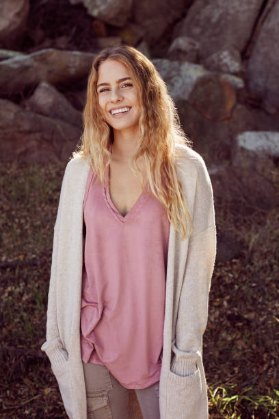 istock Laughing young woman enjoying a walk in a forest 1182138749