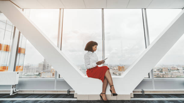 istock Woman entrepreneur with a tablet pc 1182139409