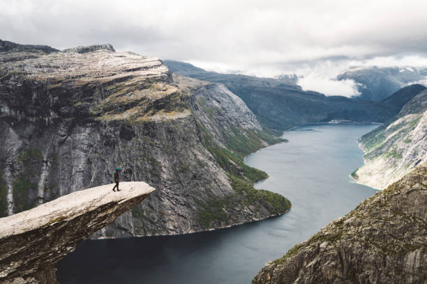 istock Man hiker standing on the edge - Trolltunga 1182143227