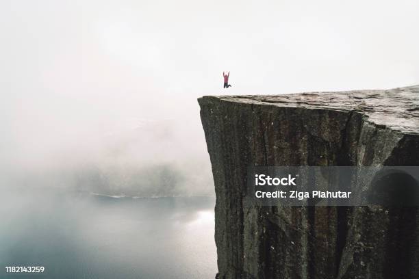 Hiker On Pulpit Rock Preikestolen Stock Photo - Download Image Now - Kristiansand, Stavanger, Trolltunga