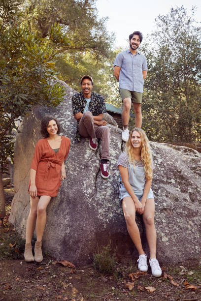 istock Smiling friends standing together on a rock while hiking 1182146088