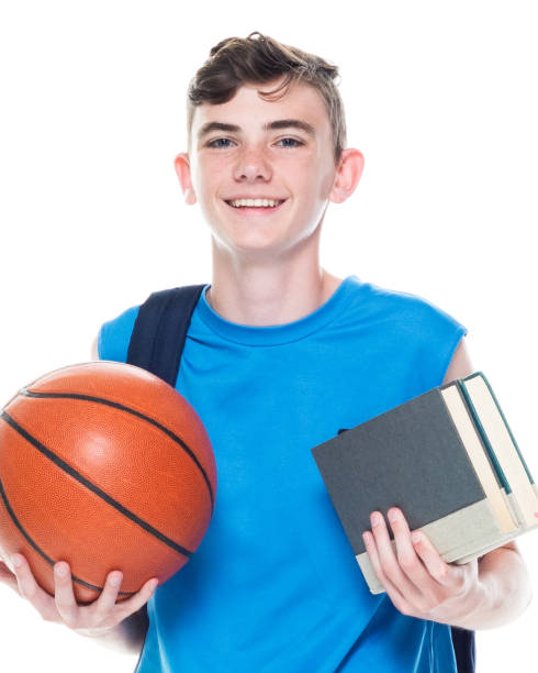 front view / one man only / one person / one teenage boy only / waist up of 12-13 years old handsome people caucasian male / young men basketball player / student / university student / junior high student / boys / teenage boys wearing backpack - 12 13 years fotos imagens e fotografias de stock