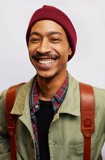 istock Smiling man wearing hiking gear standing against a gray background 1182150068