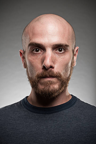 istock A young man with a beard posing for a portrait 118215098