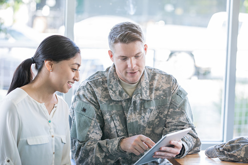 Military recruiter explaining options to new recruit