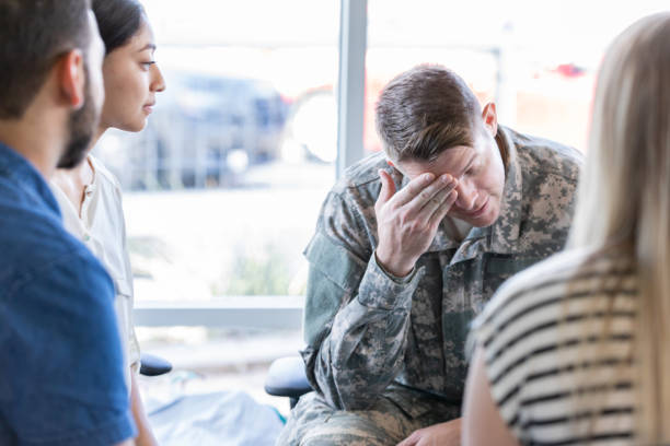 istock Depressed veteran in group counseling 1182151569