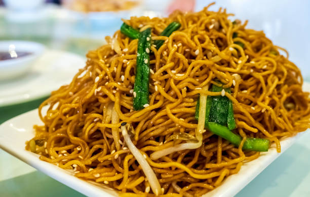 istock Chinese-style fried noodles, with scallions and bean sprouts 1182153885