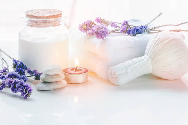 istock Spa treatments set with towel and compressing ball on white table. 1182155464