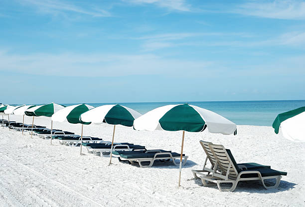 istock Beach lounge chairs and umbrellas 118215673