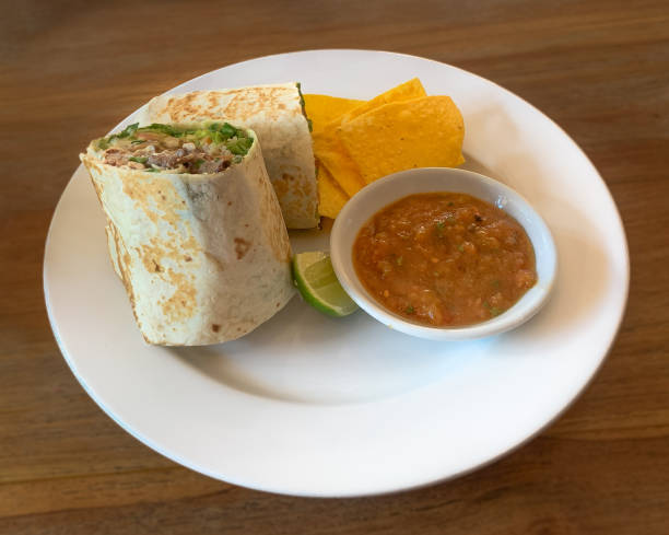 istock Beef burrito with corn chip tortilla and salsa. 1182160091
