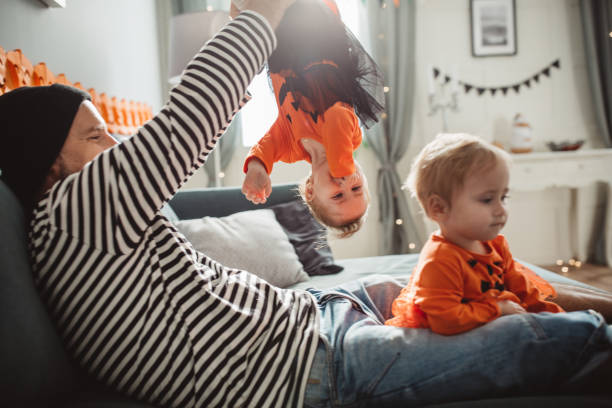 istock Happy family celebrating Halloween 1182162712
