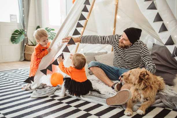 playing in tent for halloween - house home interior flag usa imagens e fotografias de stock