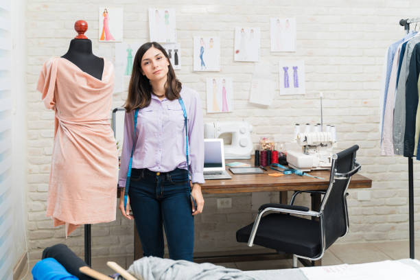 istock Young beautiful tailor working in fashion studio 1182168513