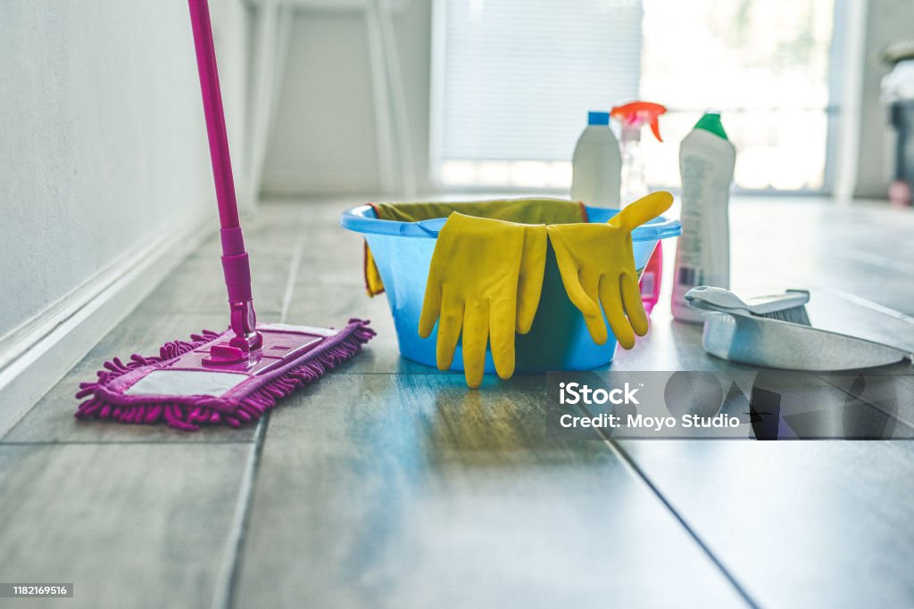 Time to clean this house from top to bottom High angle shot of various cleaning products at home Cleaning Stock Photo