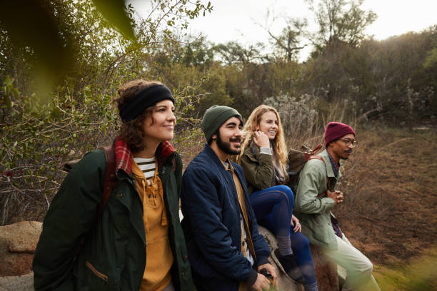 istock Smiling friends enjoying the scenery on their nature hike 1182170194