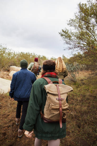 istock Friends walking together along a trail during a hike 1182171870
