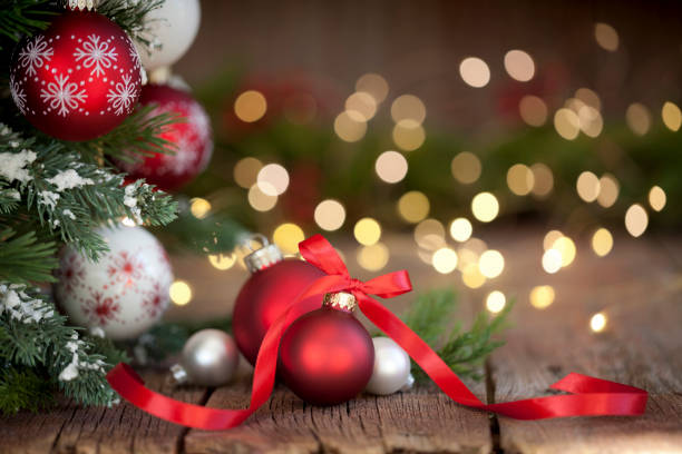 istock Christmas Tree with Red and White Ornaments on a Wood Background 1182177895