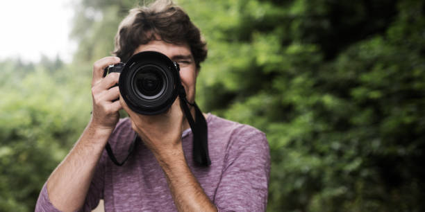 istock Photographer taking photo at you 1182183110
