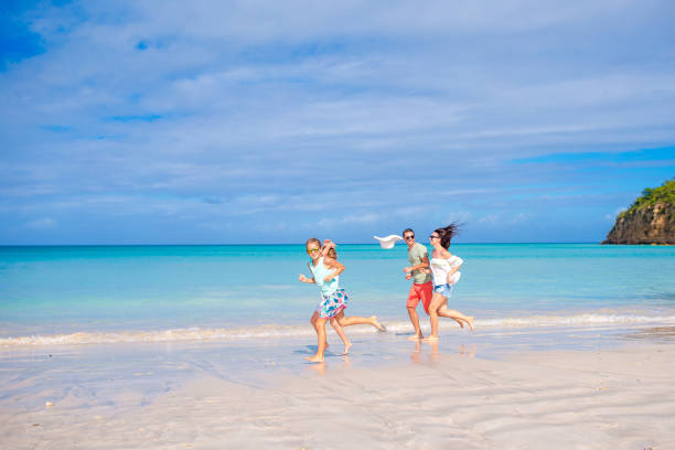 istock Happy family on the beach during summer vacation 1182185091